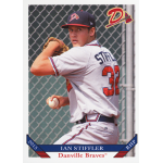ian stiffler 2015 danville braves Young baseball pitcher in Danville Braves uniform, ready to pitch, against a chain-link fence backdrop.