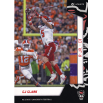 cj clark 2023 onit north carolina state wolfpack Football player in red and white uniform jumping to catch ball during a game, with crowd in the background.