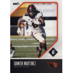 damien martinez 2023 onit oregon state beavers Football player in white uniform running with ball on the field during a game.