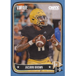 jacurri brown 2024 onyx blue A football player in black jersey and gold helmet prepares to throw a pass on a vintage trading card.
