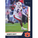 keionte scott 2023 onit university of auburn Auburn football player in white uniform running on the field during a game, showing dynamic athletic motion.