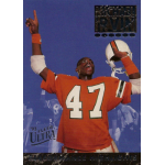 michael irvin 1993 fleer ultra performance highlights 2 Football player in orange jersey celebrates with helmet raised, posing on a vintage '93 Fleer Ultra trading card.