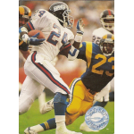 ottis anderson 1991 pro set platinum 80 Football player in white jersey runs with the ball, evading a tackle from an opposing player in a blue and yellow uniform.