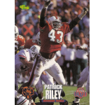 patrick riley 1995 classic draft rc Football player in a red jersey, celebrating on the field, surrounded by players during an intense game.