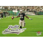 phillip buchanon 2004 fleer ultra 14 Player in black football uniform celebrating on a field, holding the ball. Crowd in background. Fleer Ultra card.