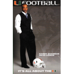 randy shannon 2007 miami hurricanes pocket schedule cropped Man in formal attire stands beside a football helmet, text reads U Football and It's All About the U.