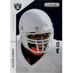 richard gordon 2011 rookies and stars longevity 231 rc Football player in full gear on a sports card, wearing a white helmet and red mouthguard, looks focused and determined.