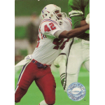 ronnie lippett 1991 pro set platinum 142 Football player in red and white uniform tackling an opponent on the field.