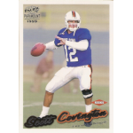 scott covington 1999 pacific paramount rc Rookie football player in action pose on 1999 trading card, wearing blue jersey, ready to throw a football.