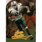 sean taylor 2004 fleer ultra gold medallion rc Football player in action with football card featuring bold design and vibrant colors.