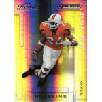 sean taylor 2004 playoff prestige purple xtra points rc Football trading card featuring a player in orange and white gear with the number 26, labeled Redskins, Rookie Extra Points.