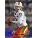 stephen morris 2014 flair showcase 113 legacy masterpiece rc Quarterback in white uniform holding football, ready to pass during a game, with text overlay and blue accents.