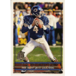steve walsh 1996 topps 327 Football player in blue jersey preparing to throw a pass during a game.