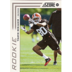 travis benjamin 2012 score rc Football player in black uniform catching a ball on the field during practice.