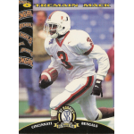 tremain mack 1997 scoreboard rc Football player running with the ball, wearing a white and red uniform, 1997 Rookie card.