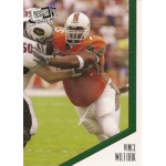 vince wilfork 2004 press pass se rc Football player in orange uniform blocking another player, action shot from a 2004 trading card.