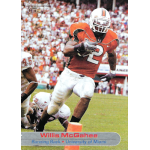willis mcgahee 2003 sports illustrated for kids Football player in orange jersey running on field during a game, with a cheering crowd in the background.